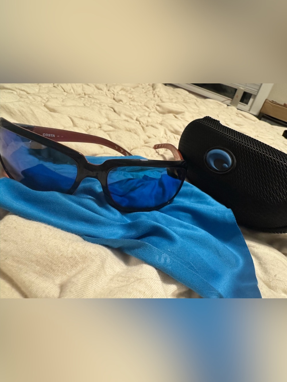 Costa Isabella Women’s Sunglasses with Blue Lenses and Black Frame